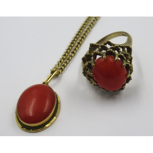 875 - Oval coral pendant (loop marked 750) on a 9ct gold chain, 5.4g, together with a 9ct gold coral set r... 