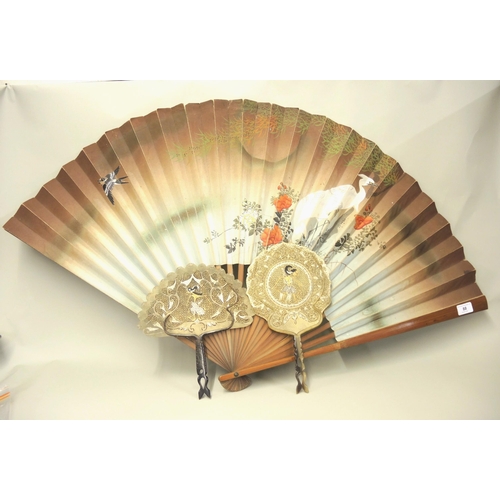 88 - Large Chinese bamboo and hand painted paper fan decorated with flowers, storks and a swallow, 60cm l... 