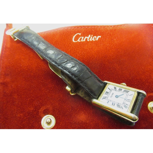 889 - Must de Cartier ladies silver gilt tank silver wristwatch, the white dial with Roman numerals, on a ... 