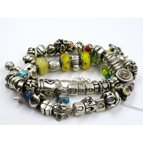 891 - Pandora heavy silver and other double row bracelet with multiple charms, gross weight 179g