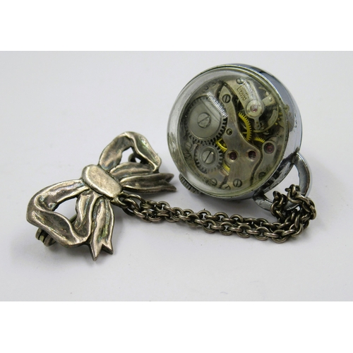 899 - Silver plated ball watch suspended from a bow