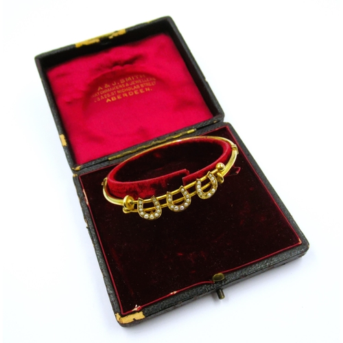 902 - Edwardian gold triple horseshoe bangle set seed pearls (at fault), 7g