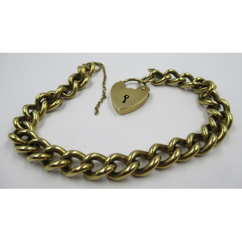 903 - Heavy 9ct gold curb link bracelet with padlock clasp, 45g