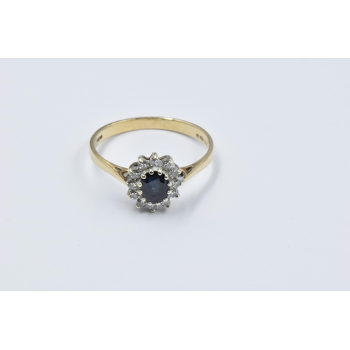 938 - 9ct Yellow gold sapphire and diamond set flower head ring