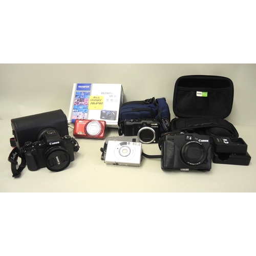 94 - Two Canon digital cameras, similar Olympus camera and other miscellaneous items