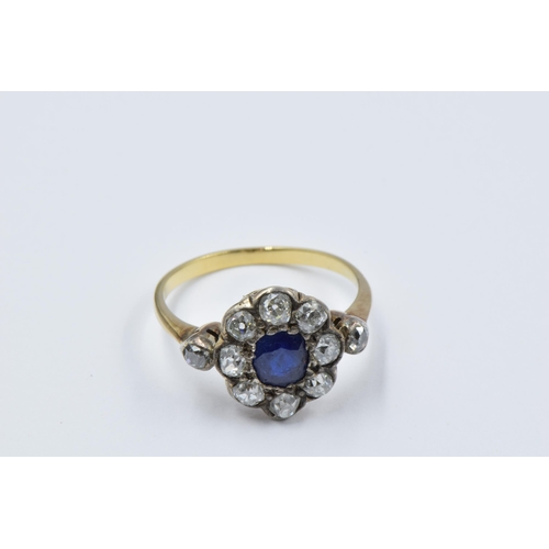 973 - Antique yellow gold ring with central sapphire surrounded by old cut diamonds