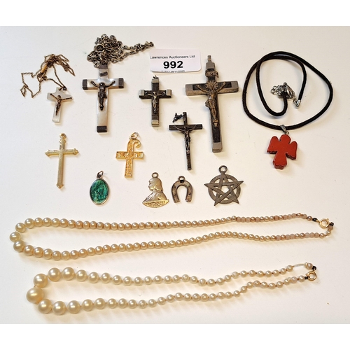 992 - Bag containing a small quantity of various pendants including crucifixes etc.