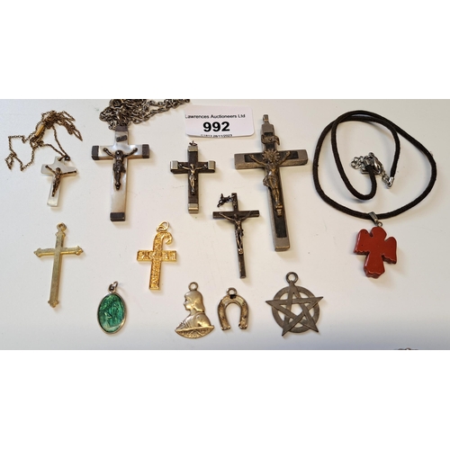 992 - Bag containing a small quantity of various pendants including crucifixes etc.