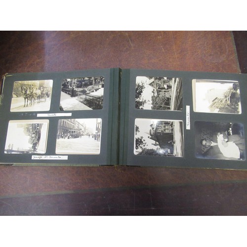 303 - Four photograph albums containing a quantity of 19th Century and later photographs of Canada, Fiji, ... 