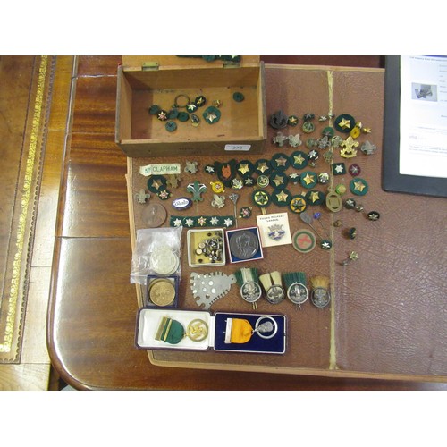 276 - Box containing a quantity of miscellaneous scouting related badges and buttons etc., together with a... 