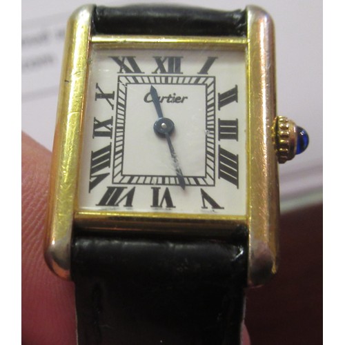 889 - Must de Cartier ladies silver gilt tank silver wristwatch, the white dial with Roman numerals, on a ... 