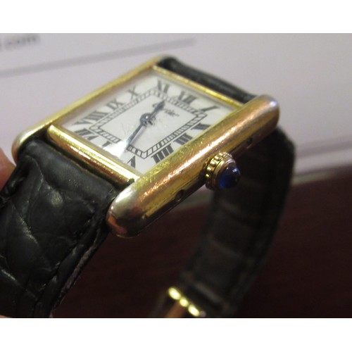 889 - Must de Cartier ladies silver gilt tank silver wristwatch, the white dial with Roman numerals, on a ... 