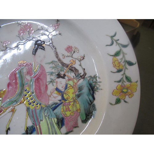 657 - Chinese enamel decorated plate, decorated with figures and an animal (crack to edge), 23cm diameter