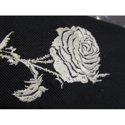 67 - Alexander McQueen, black tie with rose embroidered decoration