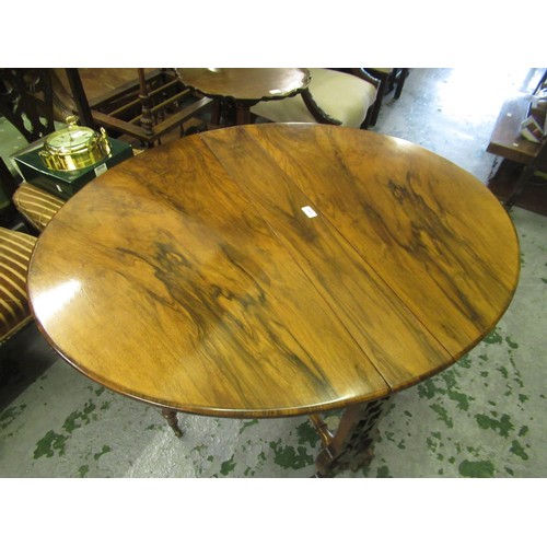 2043 - Victorian figured walnut oval drop-leaf Sutherland table on shaped pierced end supports with turned ... 