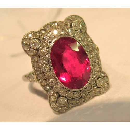 1035 - Early 20th Century oval treated or synthetic ruby and diamond dress ring, the ruby approximately 10m... 