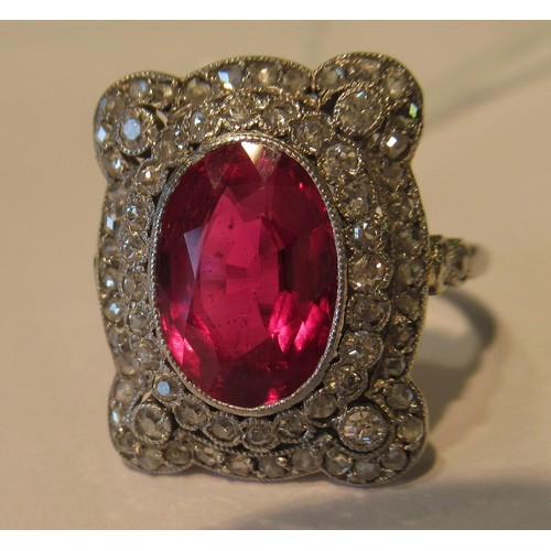 1035 - Early 20th Century oval treated or synthetic ruby and diamond dress ring, the ruby approximately 10m... 