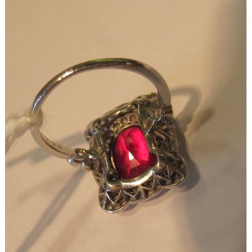 1035 - Early 20th Century oval treated or synthetic ruby and diamond dress ring, the ruby approximately 10m... 