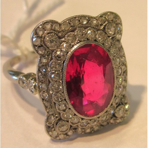 1035 - Early 20th Century oval treated or synthetic ruby and diamond dress ring, the ruby approximately 10m... 