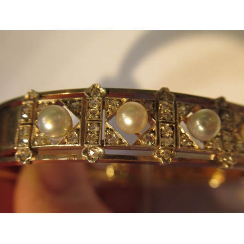 1031 - Late 19th / early 20th Century rose gold cultured pearl and rose cut diamond bangle, in the original... 