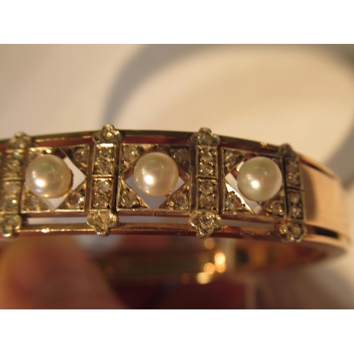 1031 - Late 19th / early 20th Century rose gold cultured pearl and rose cut diamond bangle, in the original... 