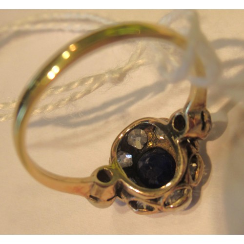 973 - Antique yellow gold ring with central sapphire surrounded by old cut diamonds