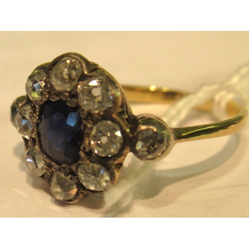 973 - Antique yellow gold ring with central sapphire surrounded by old cut diamonds