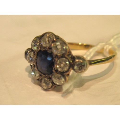 973 - Antique yellow gold ring with central sapphire surrounded by old cut diamonds