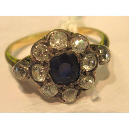 973 - Antique yellow gold ring with central sapphire surrounded by old cut diamonds