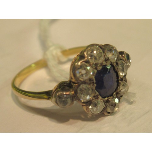 973 - Antique yellow gold ring with central sapphire surrounded by old cut diamonds