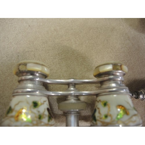 102 - Pair of enamel decorated opera glasses together with three plated condiment sets