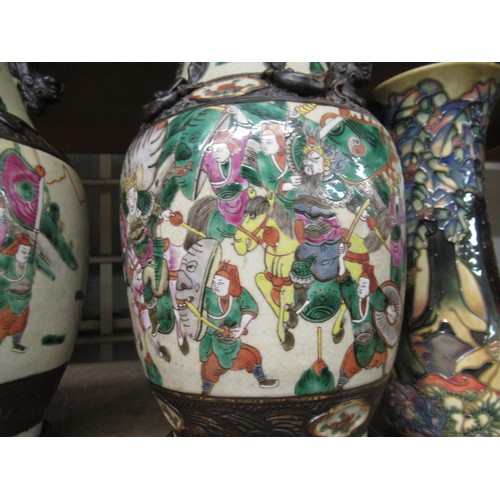 558 - Pair of 19th Century Chinese crackleware enamel decorated vases, decorated with various figures on h... 