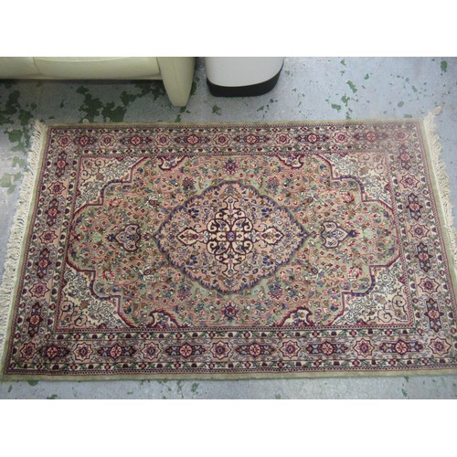 9 - Indo Persian rug with a lobed medallion and all-over floral design on a pale green ground with borde... 