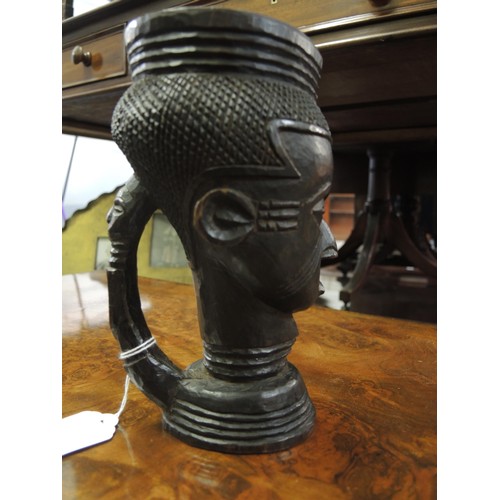 127 - Congolese (Kuba) tribal African carved palm wood wine cup in the form of a female head with figural ... 