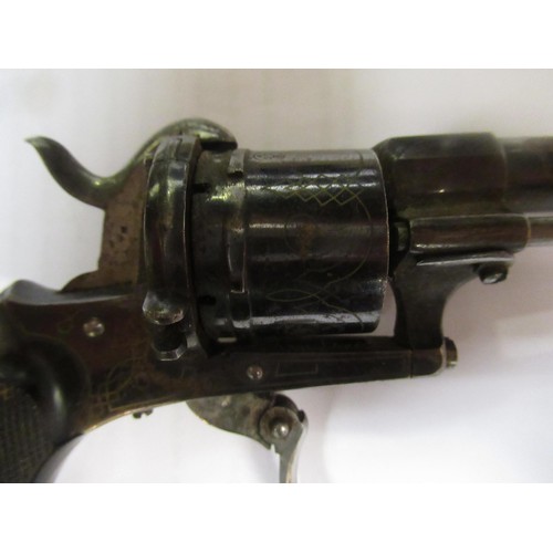 275 - Late 19th Century / early 20th Century rim fire revolver with folding trigger and knurled ebony grip... 