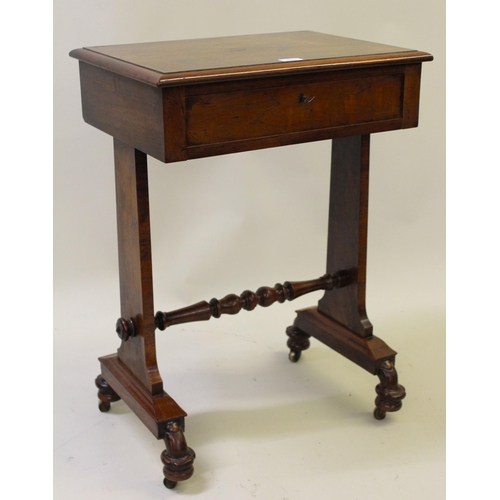 19th Century rosewood work table, the rectangular moulded top above a single frieze drawer, with fitted interior raised on shaped end supports united by turned stretcher with brass casters, 75cm high x 53cm wide x 39cm deep