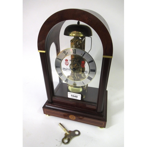 1040 - Reproduction mahogany cased mantel clock, the silvered dark and gilt patinated dial with Roman numer... 