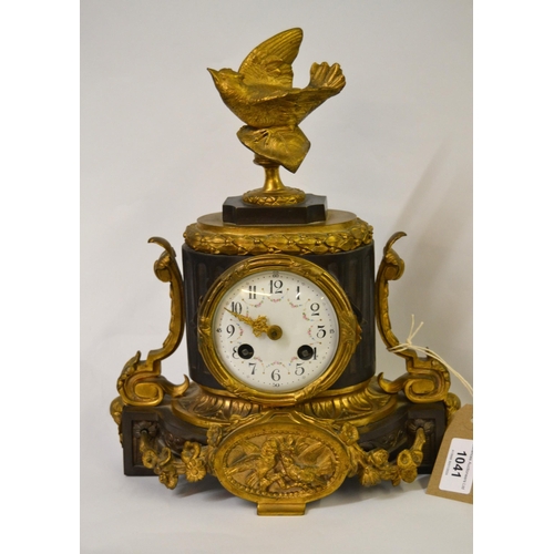 1041 - 19th Century bronze and gilt metal mantel clock, surmounted with a figure of a bird having circular ... 