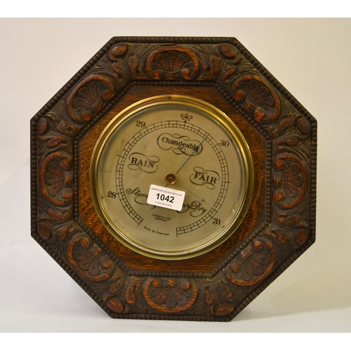 1042 - John Barker, Kensington, aneroid barometer in an octagonal carved oak case