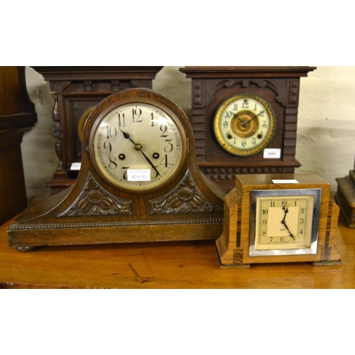 1043 - Two American two train mantel clocks, an oak cased dome shaped two train mantel clock and a small wa... 