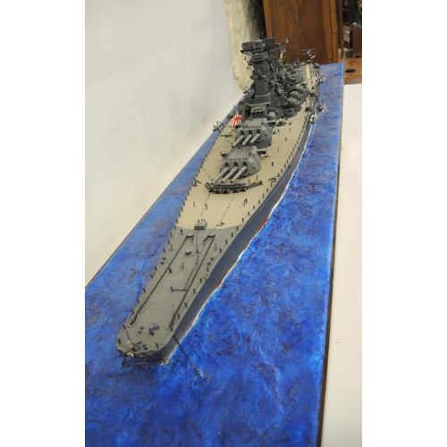 121 - Built 1/350 scale model of IJN Yamato battleship on a plinth base, 154cm x 32cm