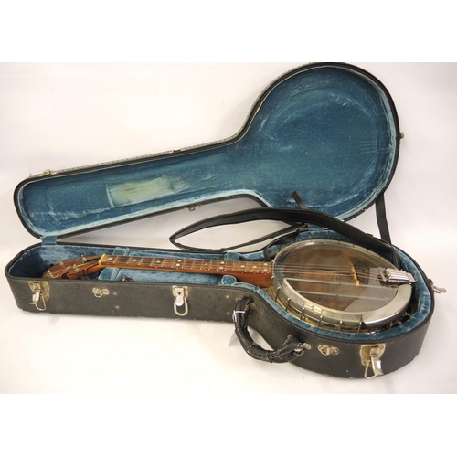 131 - Bohee four string banjo with inlaid walnut back and sides in a fitted case