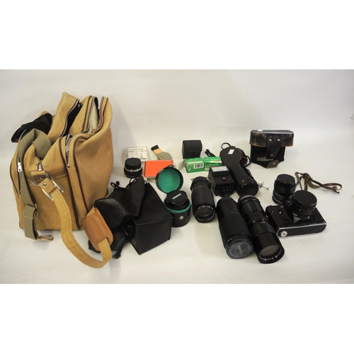 136 - Russian Zenit camera, together with a quantity of various lenses including Takumar, Vivitar and Ozek... 