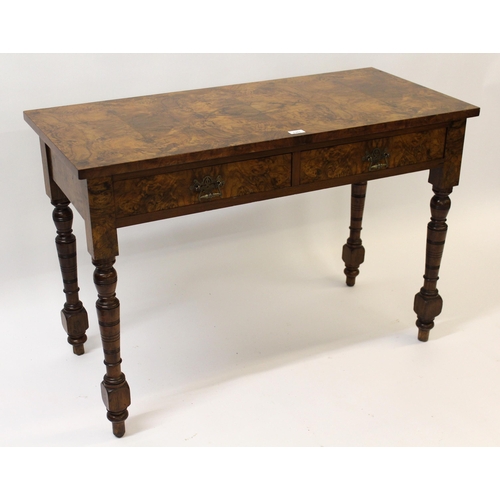 Late Victorian figured walnut side table with two drawers raised on turned supports, 108cm wide
