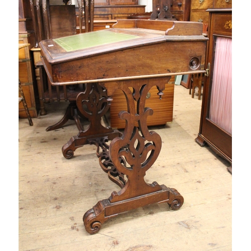 1433 - Victorian walnut Davenport on shaped and pierced supports with stretcher