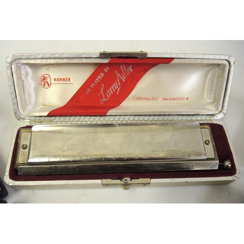 146 - Larry Adler, Professional 16 Chromatic harmonica in original box, together with four other various h... 