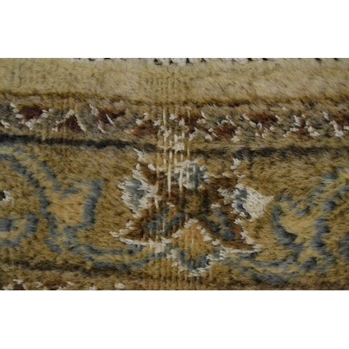 18 - Nain carpet with a medallion and all-over floral design on a beige ground with borders (some moth da... 