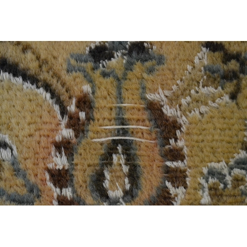 18 - Nain carpet with a medallion and all-over floral design on a beige ground with borders (some moth da... 