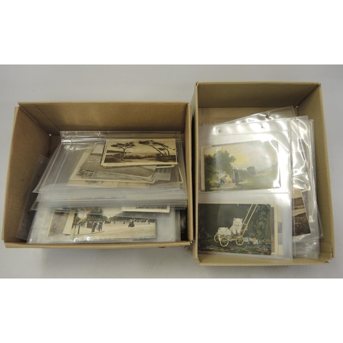 187 - Two boxes containing a large collection of miscellaneous postcards