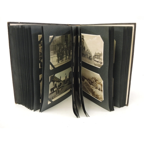 189 - Leather bound album containing a collection of miscellaneous postcards